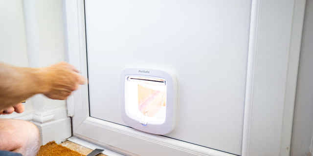 Complete fitted cat flap in a UPVC door