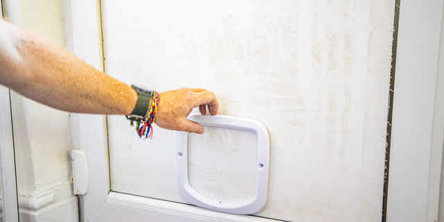 Using cat flap as template to measure on door